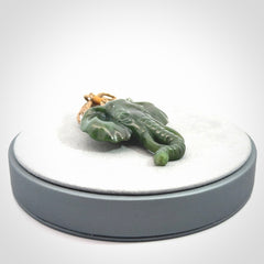 This is a hand made elephant pendant. Carved in a beautiful darker green piece of British Columbian jade. The cord is hand-plaited in a tan colour and is length adjustable. Provided in a woven kete pouch and delivered with express courier.