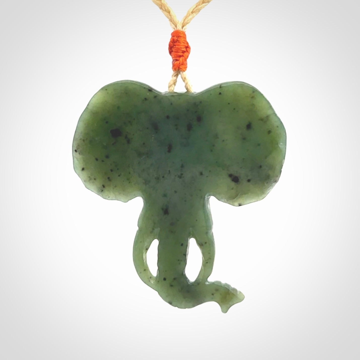 This is a hand made elephant pendant. Carved in a beautiful darker green piece of British Columbian jade. The cord is hand-plaited in a oat colour and is length adjustable. Provided in a woven kete pouch and delivered with express courier.