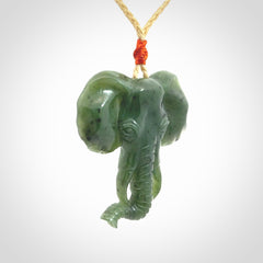 This is a hand made elephant pendant. Carved in a beautiful darker green piece of British Columbian jade. The cord is hand-plaited in a oat colour and is length adjustable. Provided in a woven kete pouch and delivered with express courier.