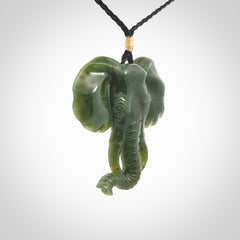 This is a hand made elephant pendant. Carved in a beautiful darker green piece of British Columbian jade. The cord is hand-plaited in a black colour and is length adjustable. Provided in a woven kete pouch and delivered with express courier.