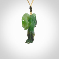 This is a hand made elephant pendant. Carved in a beautiful darker green piece of Aceh jade. The cord is hand-plaited in an Oat colour and is length adjustable. Provided in a woven kete pouch and delivered with express courier.