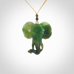 This is a hand made elephant pendant. Carved in a beautiful darker green piece of Aceh jade. The cord is hand-plaited in an Oat colour and is length adjustable. Provided in a woven kete pouch and delivered with express courier.