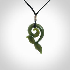 An absolutely stunning jade whale tail pendant