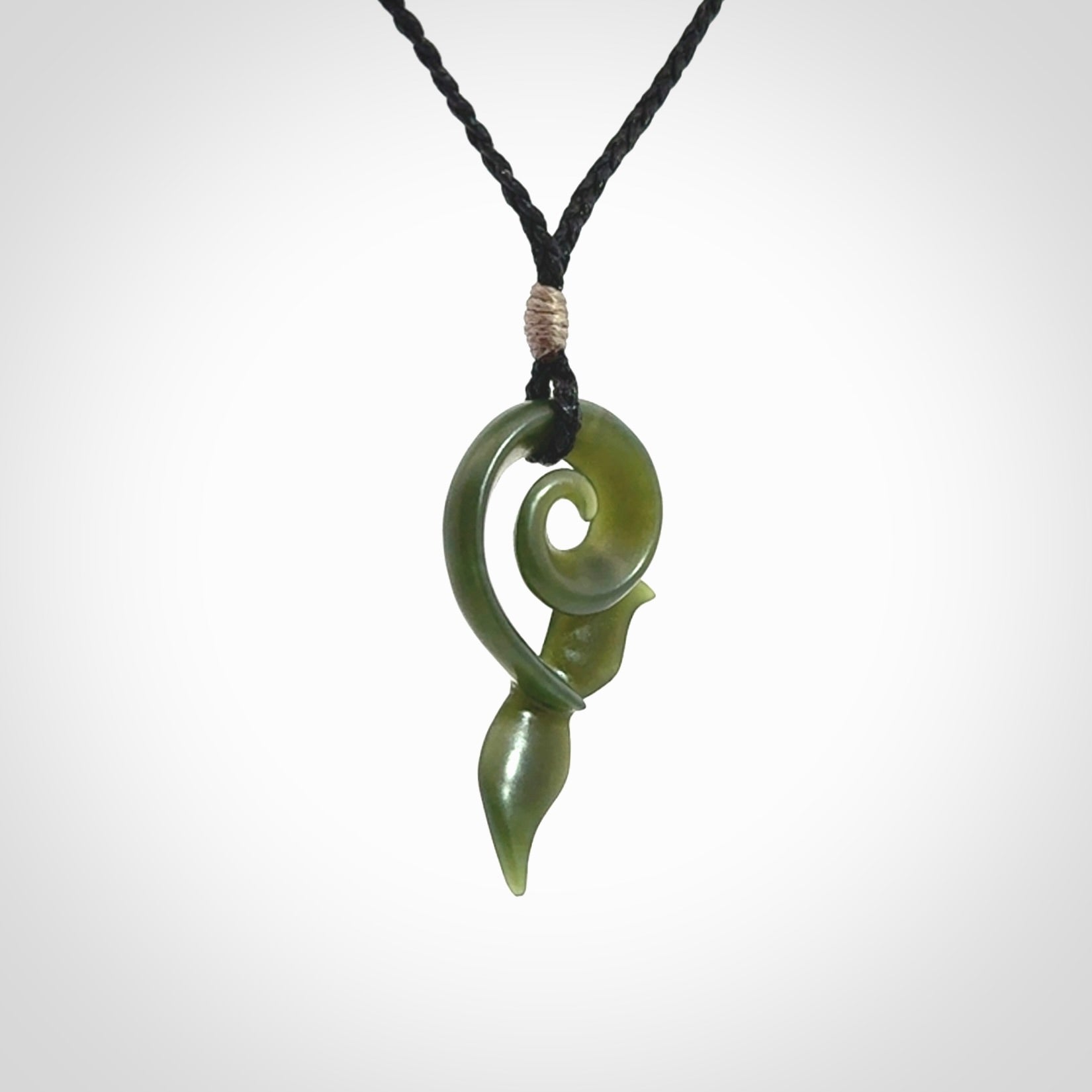 An absolutely stunning jade whale tail pendant