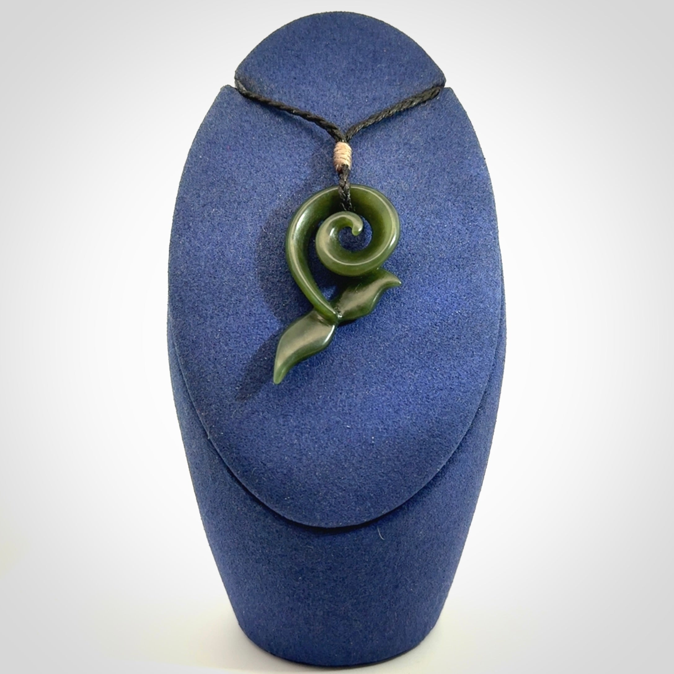 An absolutely stunning jade whale tail pendant