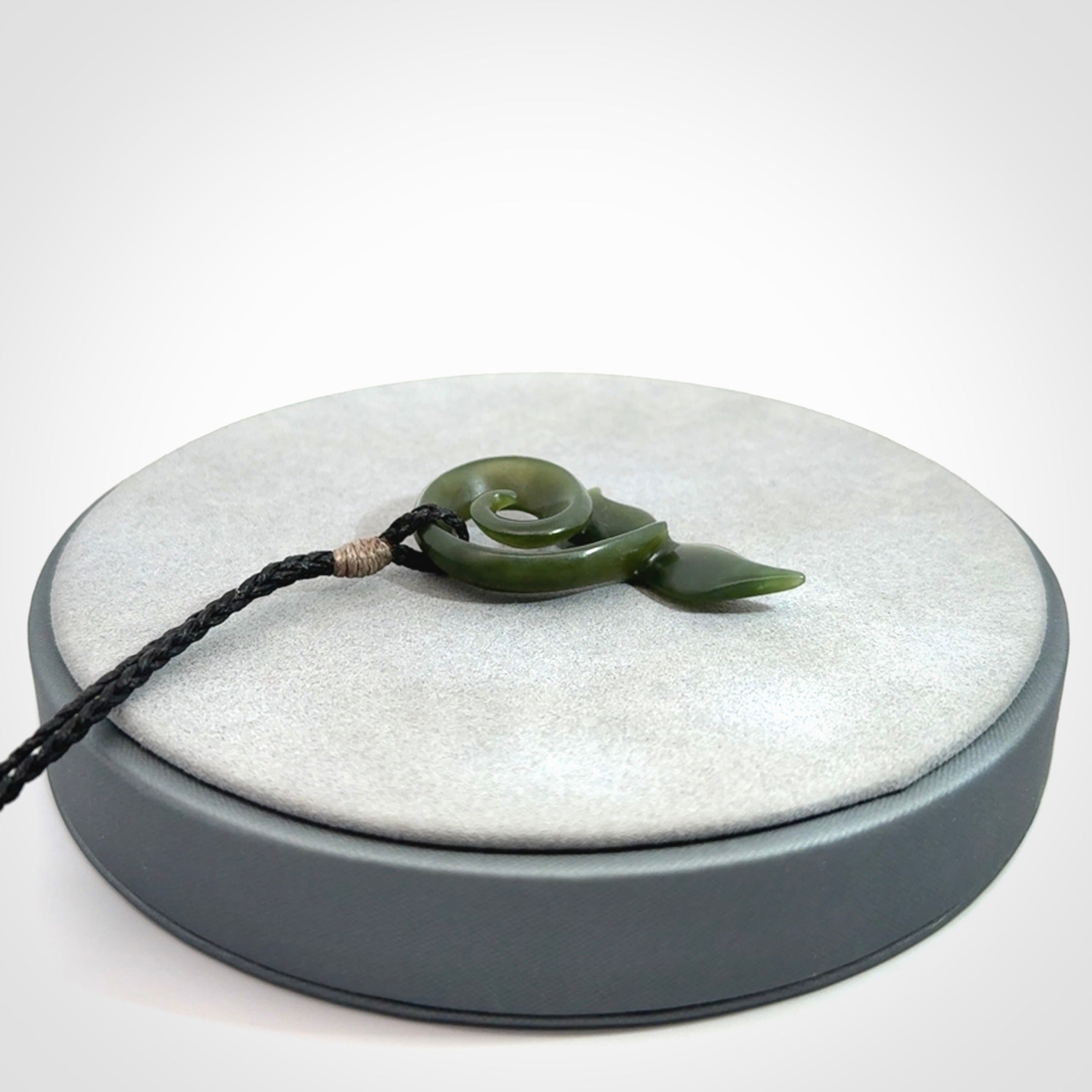An absolutely stunning jade whale tail pendant