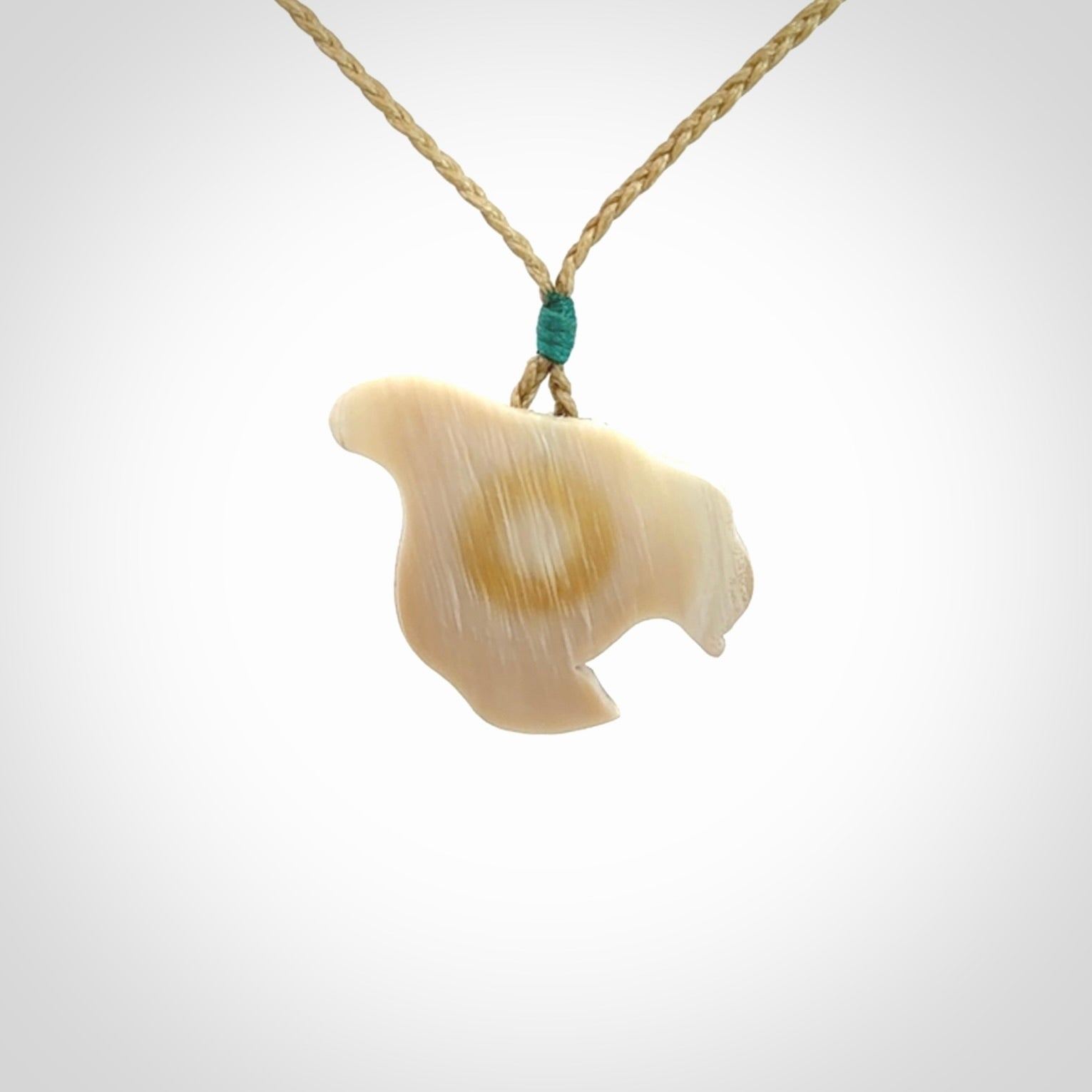Hand carved woolly mammoth tusk pendant