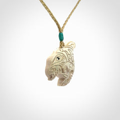 Hand carved woolly mammoth tusk pendant