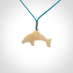 A little dolphin pendant, carved in mammoth tusk