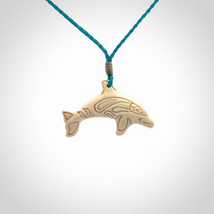 A little dolphin pendant, carved in mammoth tusk