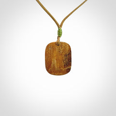 Hand carved woolly mammoth tusk pendant