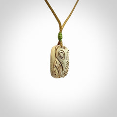 Hand carved woolly mammoth tusk pendant