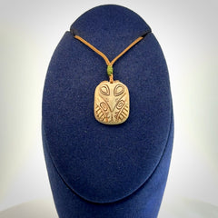 Hand carved woolly mammoth tusk pendant