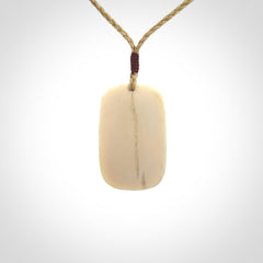 Hand carved woolly mammoth tusk pendant