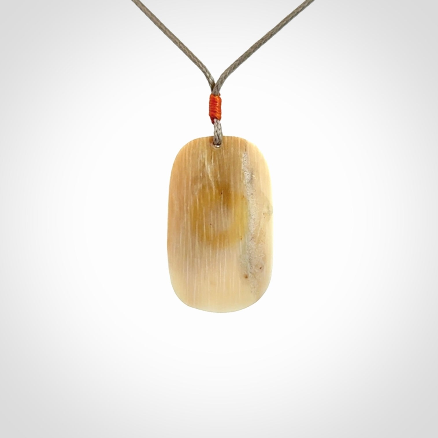 A wonderful pendant, carved in mammoth tusk