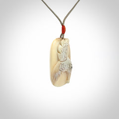 A wonderful pendant, carved in mammoth tusk