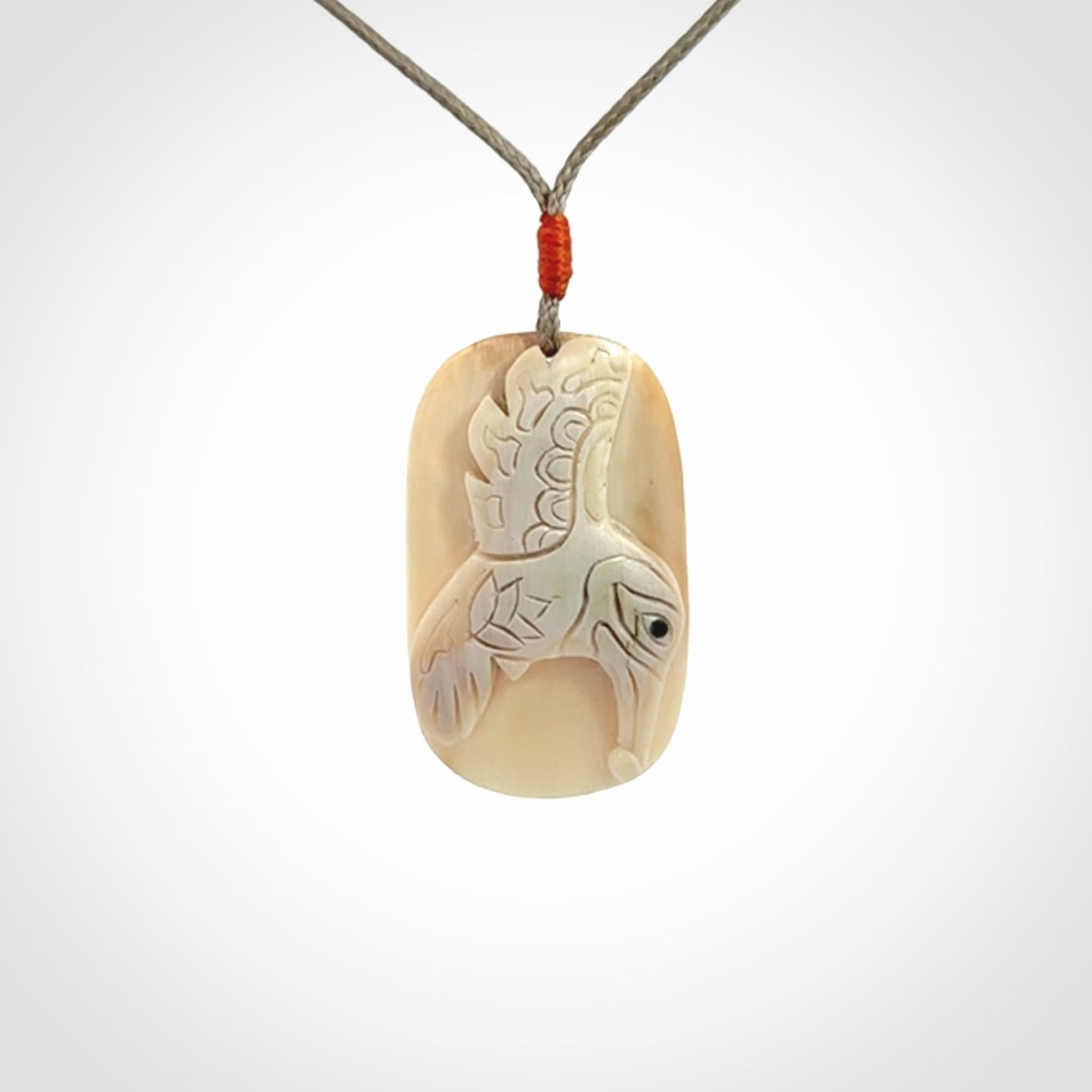 A wonderful pendant, carved in mammoth tusk
