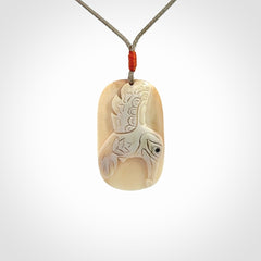 A wonderful pendant, carved in mammoth tusk