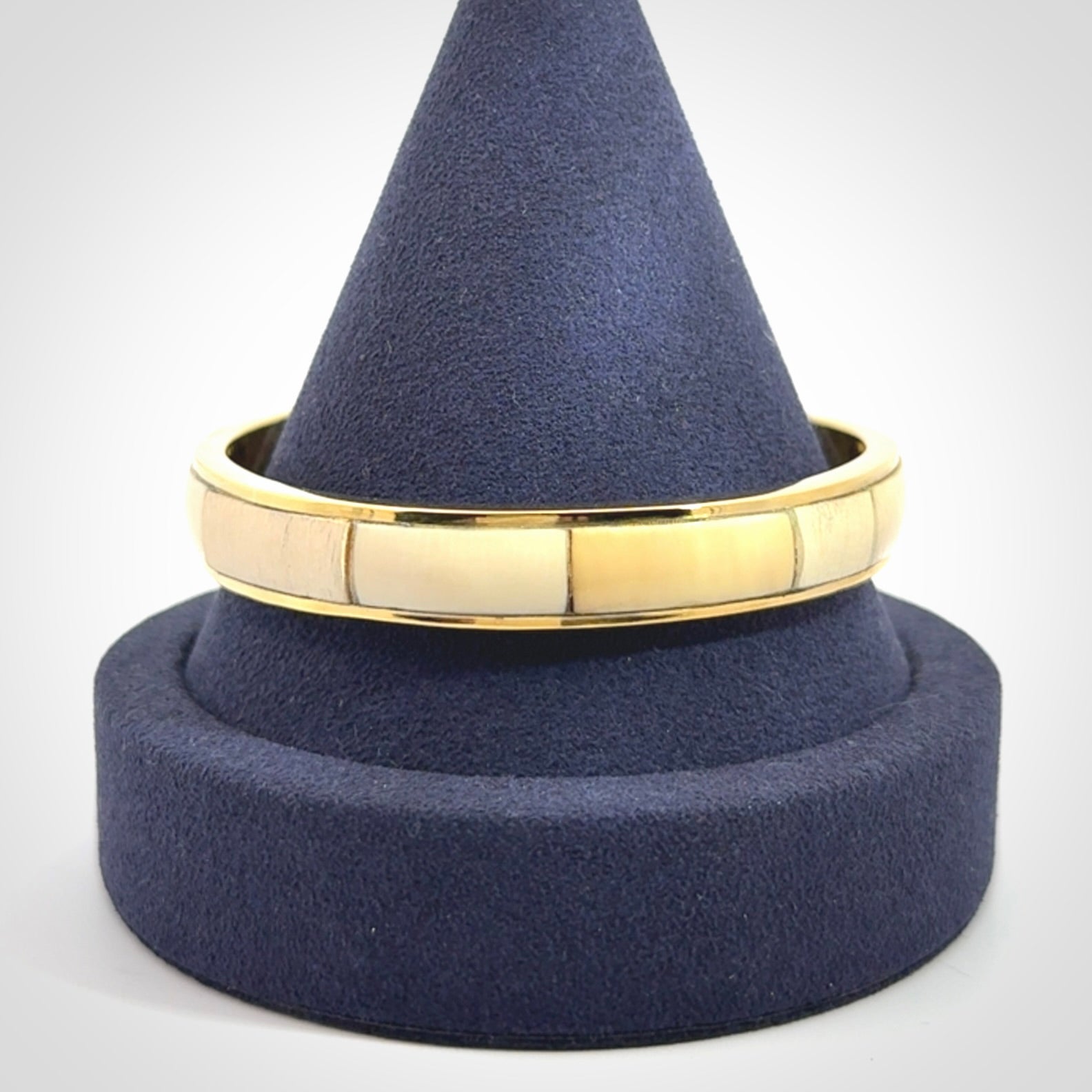 This piece is a hand made bracelet. It is made from selected pieces of woolly mammoth tusk which we have cut and polished and then inset into a brass bracelet. It is a very striking piece one of a kind and truly beautiful.