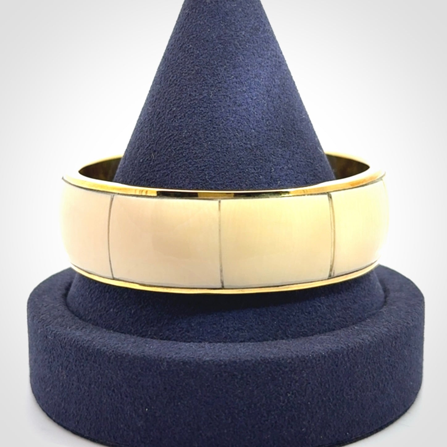 This piece is a hand made bracelet. It is made from selected pieces of woolly mammoth tusk which we have cut and polished and then inset into a brass bracelet. It is a very striking piece one of a kind and truly beautiful.