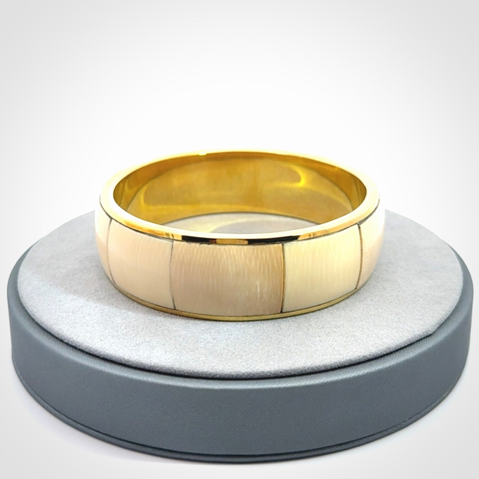 This piece is a hand made bracelet. It is made from selected pieces of woolly mammoth tusk which we have cut and polished and then inset into a brass bracelet. It is a very striking piece one of a kind and truly beautiful.
