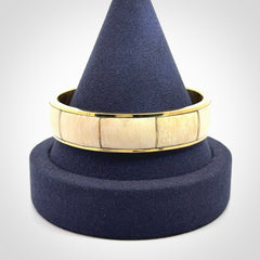 This piece is a hand made bracelet. It is made from selected pieces of woolly mammoth tusk which we have cut and polished and then inset into a brass bracelet. It is a very striking piece one of a kind and truly beautiful.