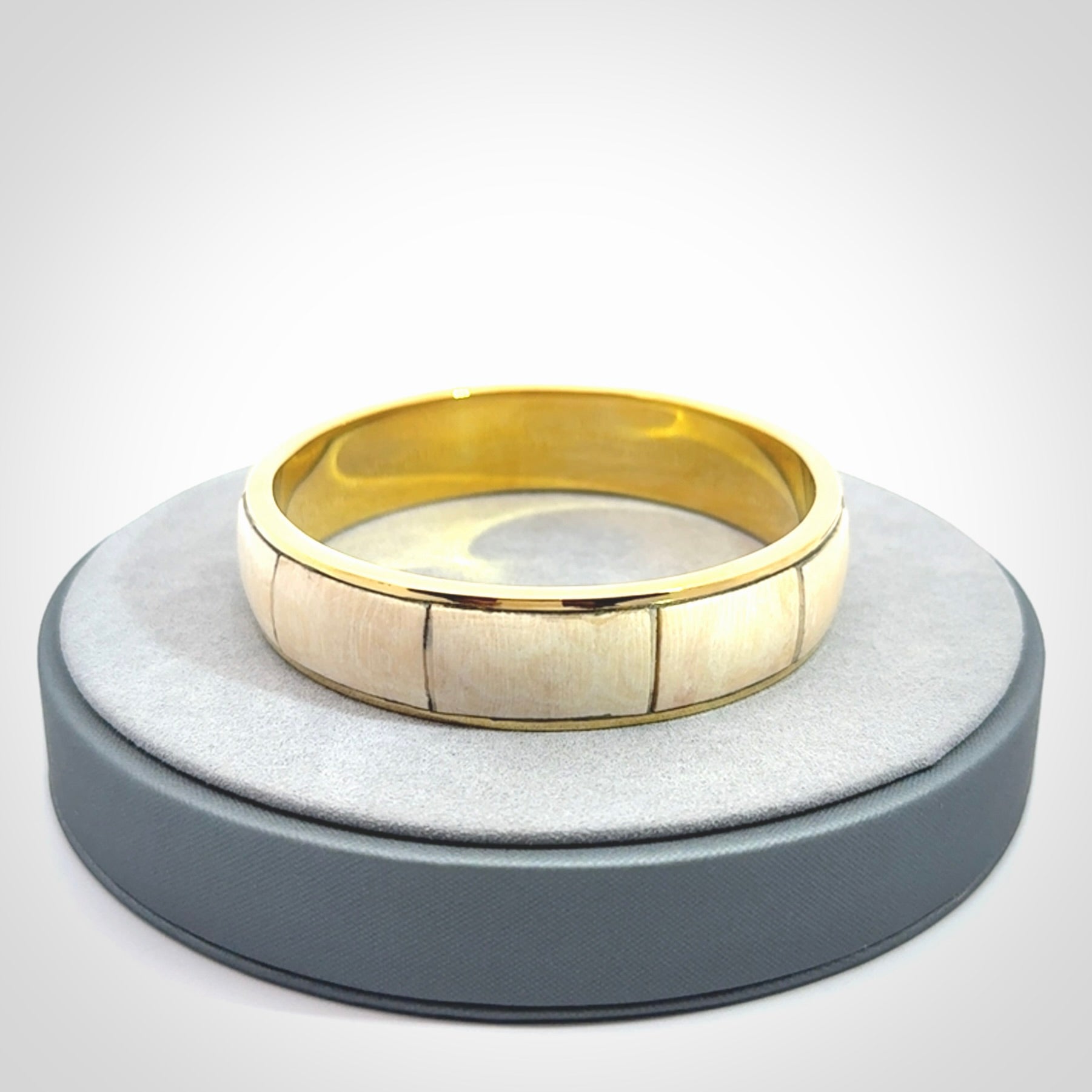 This piece is a hand made bracelet. It is made from selected pieces of woolly mammoth tusk which we have cut and polished and then inset into a brass bracelet. It is a very striking piece one of a kind and truly beautiful.