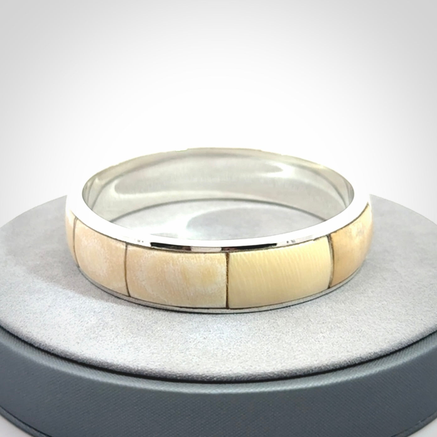 This piece is a hand made bracelet. It is made from selected pieces of woolly mammoth tusk which we have cut and polished and then inset into a sterling silver bracelet. It is a very striking piece one of a kind and truly beautiful.
