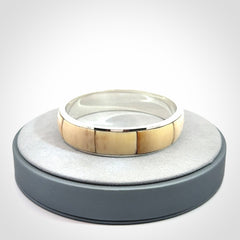 This piece is a hand made bracelet. It is made from selected pieces of woolly mammoth tusk which we have cut and polished and then inset into a sterling silver bracelet. It is a very striking piece one of a kind and truly beautiful.