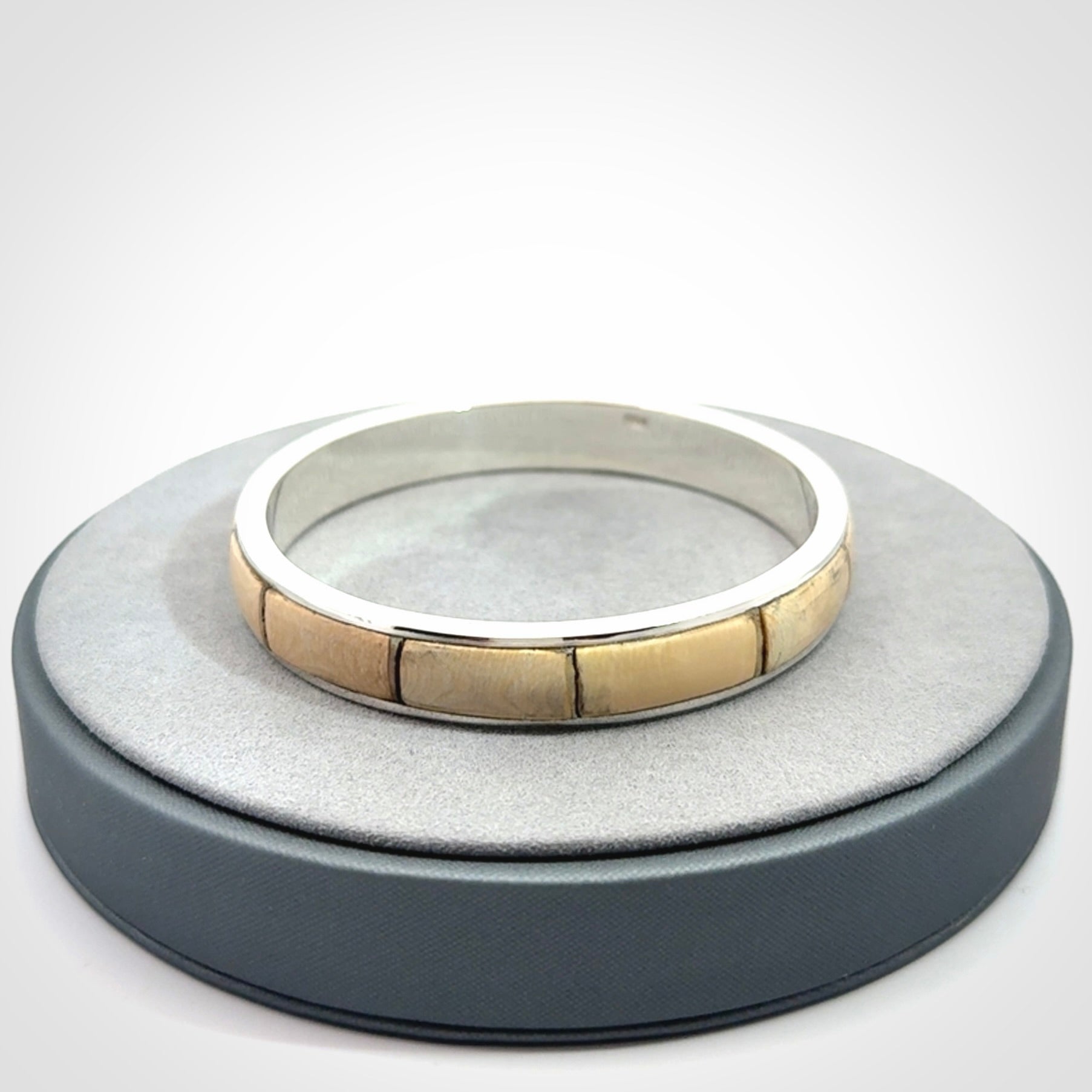 This piece is a hand made bracelet. It is made from selected pieces of woolly mammoth tusk which we have cut and polished and then inset into a sterling silver bracelet. It is a very striking piece one of a kind and truly beautiful.