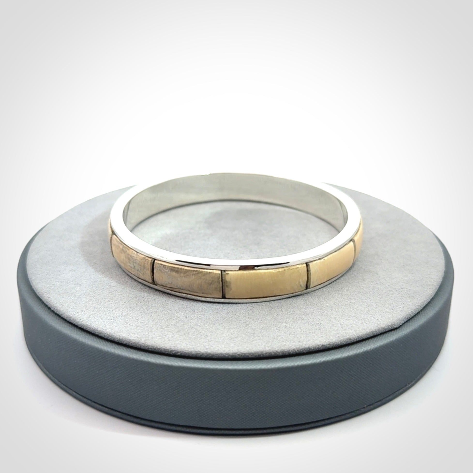 This piece is a hand made bracelet. It is made from selected pieces of woolly mammoth tusk which we have cut and polished and then inset into a sterling silver bracelet. It is a very striking piece one of a kind and truly beautiful.