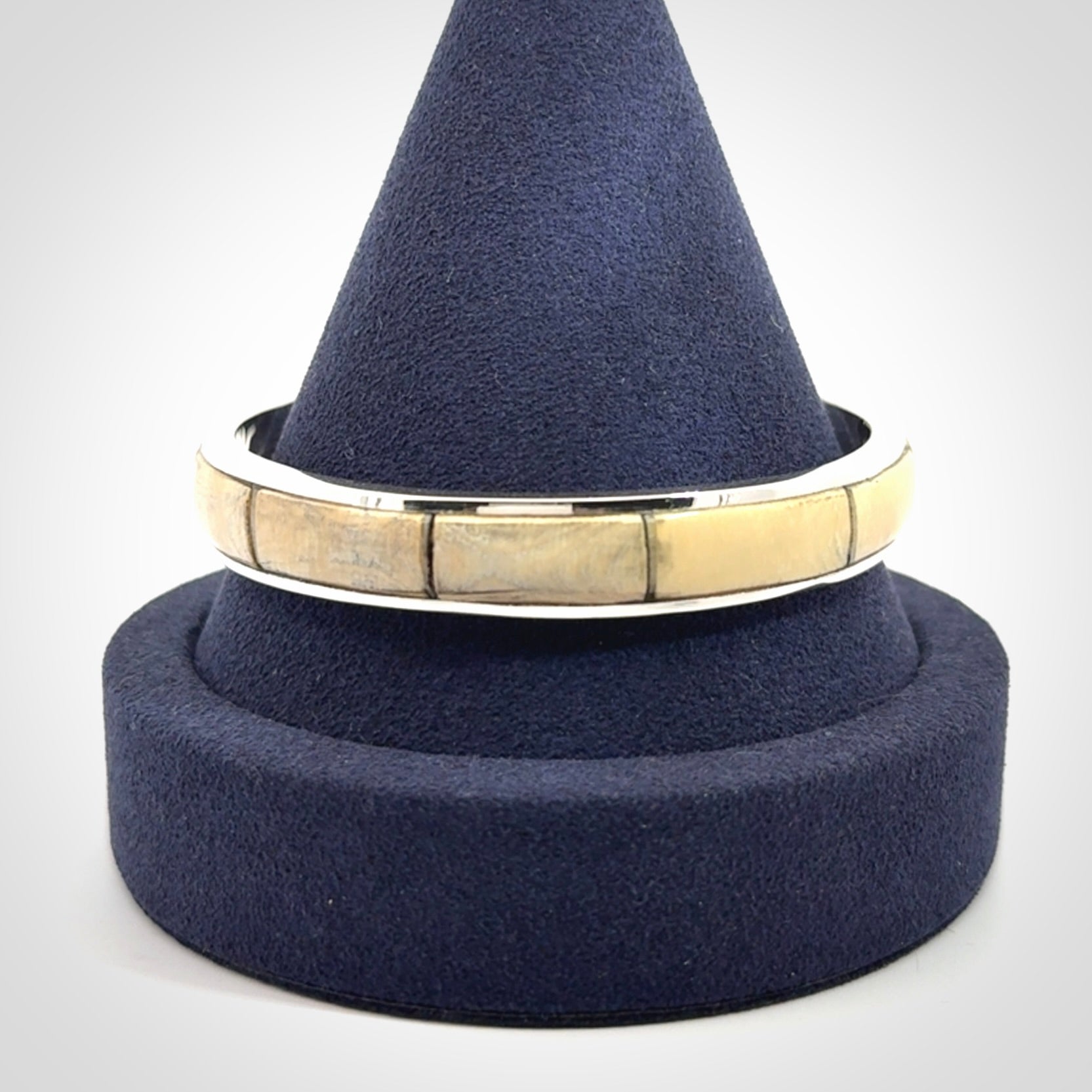 This piece is a hand made bracelet. It is made from selected pieces of woolly mammoth tusk which we have cut and polished and then inset into a sterling silver bracelet. It is a very striking piece one of a kind and truly beautiful.