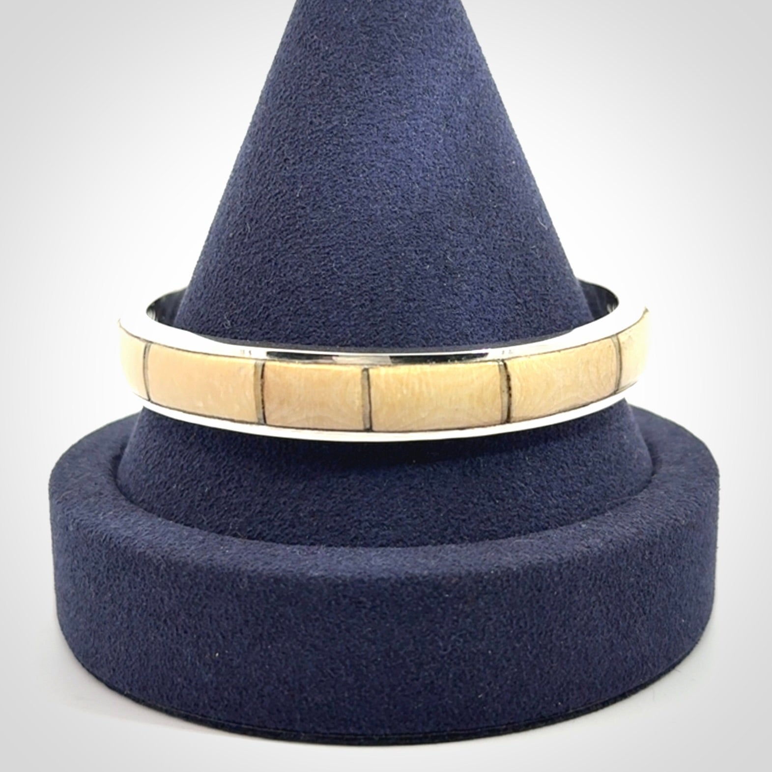 This piece is a hand made bracelet. It is made from selected pieces of woolly mammoth tusk which we have cut and polished and then inset into a sterling silver bracelet. It is a very striking piece one of a kind and truly beautiful.