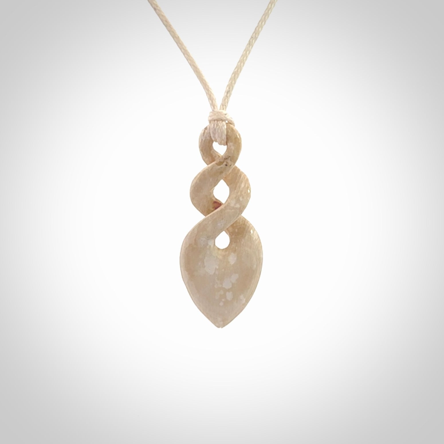 Hand carved woolly mammoth tusk twist pendant. Hand made jewellery made by NZ Pacific and for sale online.