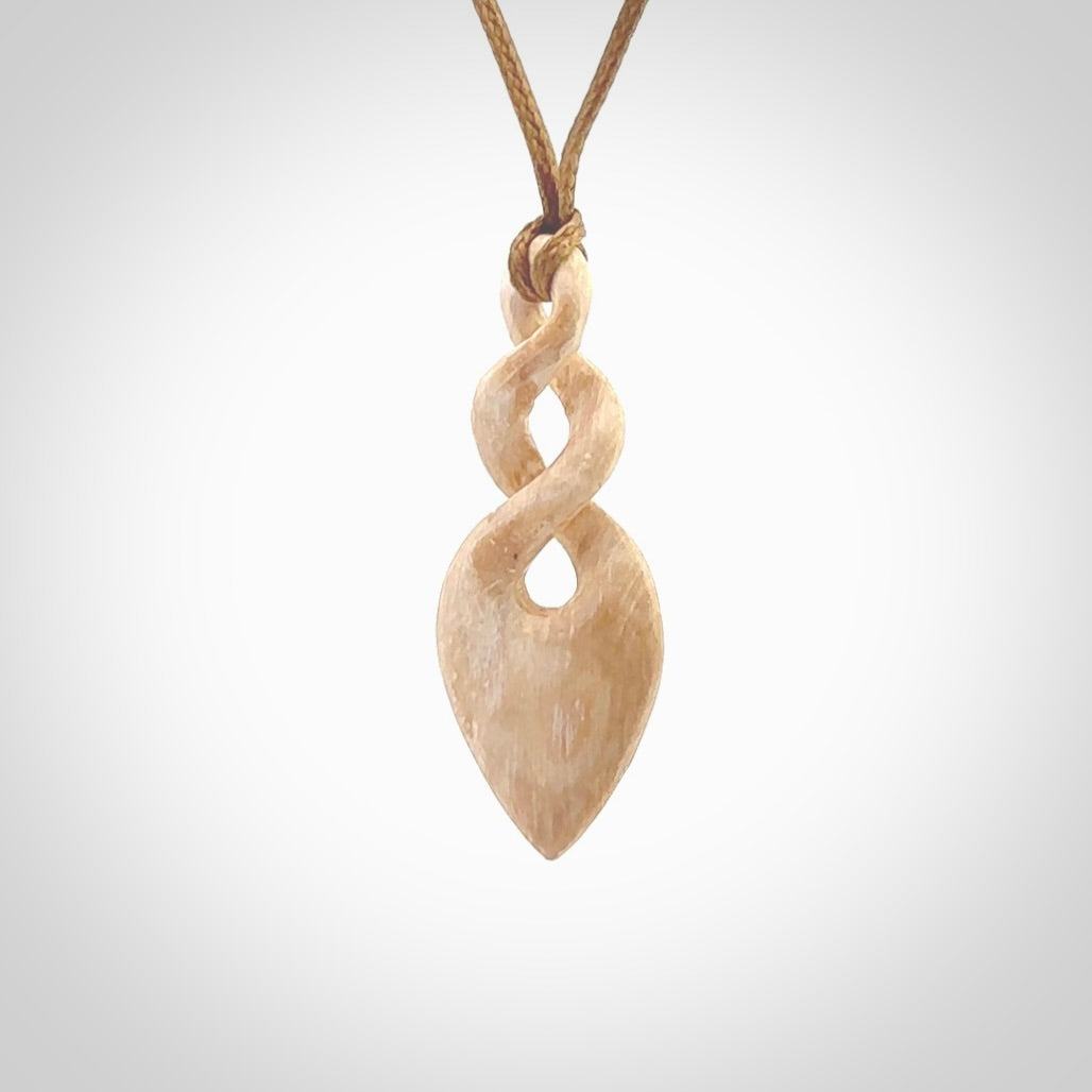 Hand carved woolly mammoth tusk twist pendant. Hand made jewellery made by NZ Pacific and for sale online.
