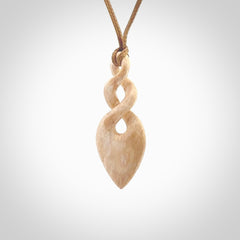 Hand carved woolly mammoth tusk twist pendant. Hand made jewellery made by NZ Pacific and for sale online.