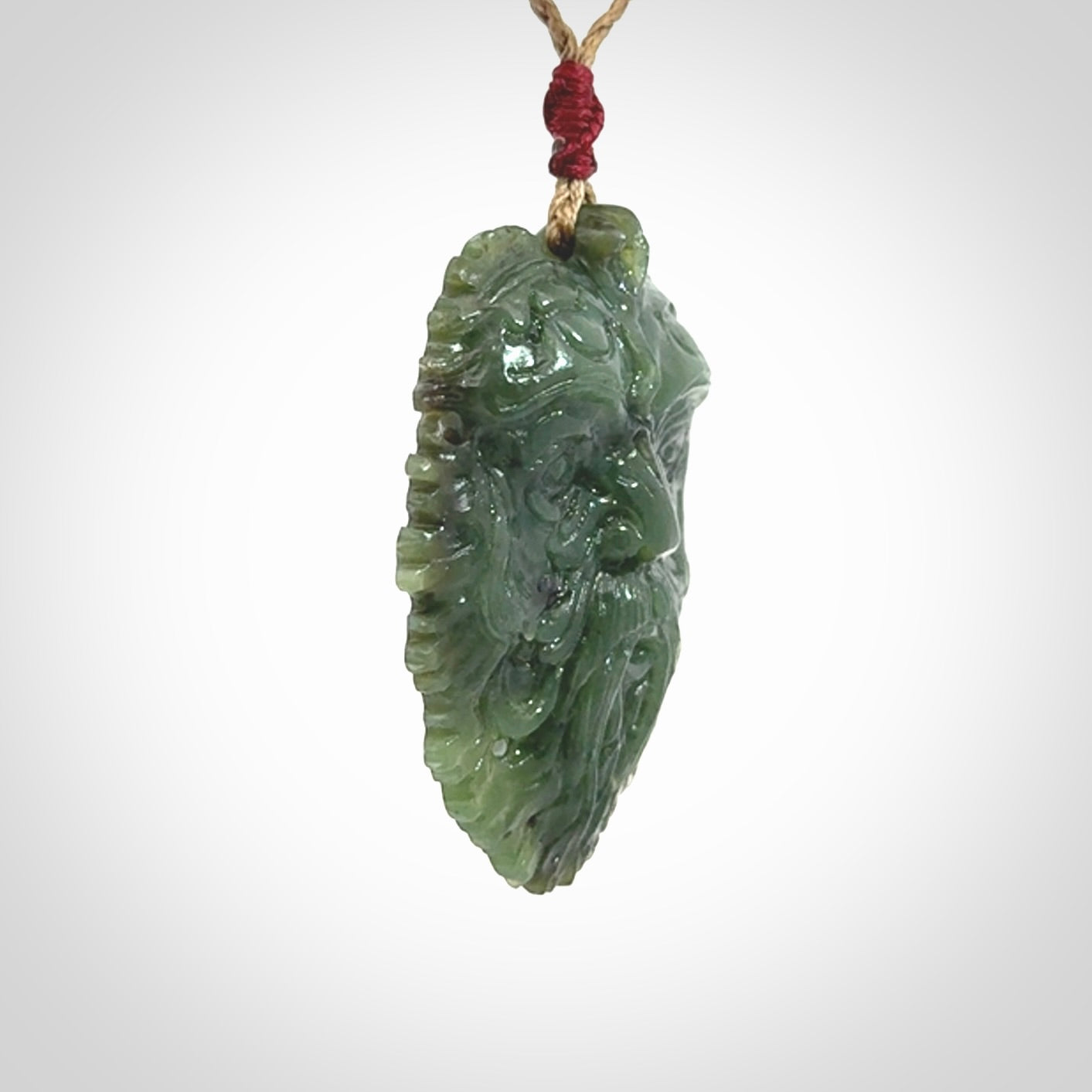 This picture shows a large hand carved forest man face pendant. The cord is hand plaited and adjustable.