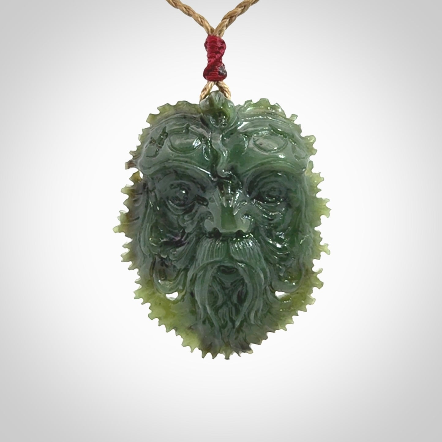 This picture shows a large hand carved forest man face pendant. The cord is hand plaited and adjustable.