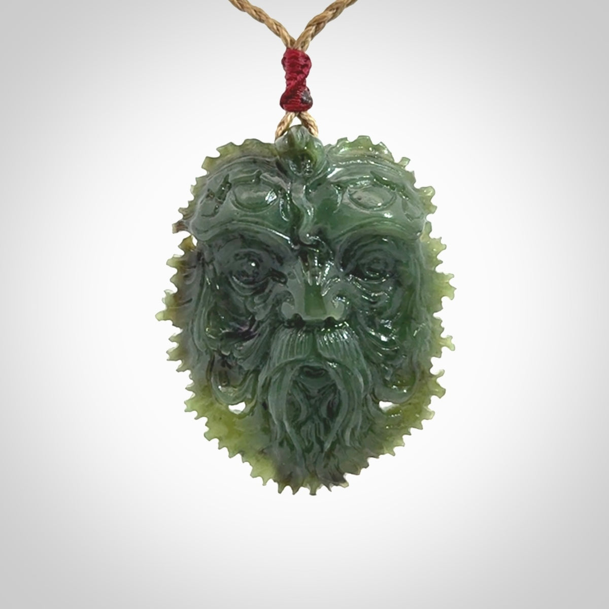 This picture shows a large hand carved forest man face pendant. The cord is hand plaited and adjustable.
