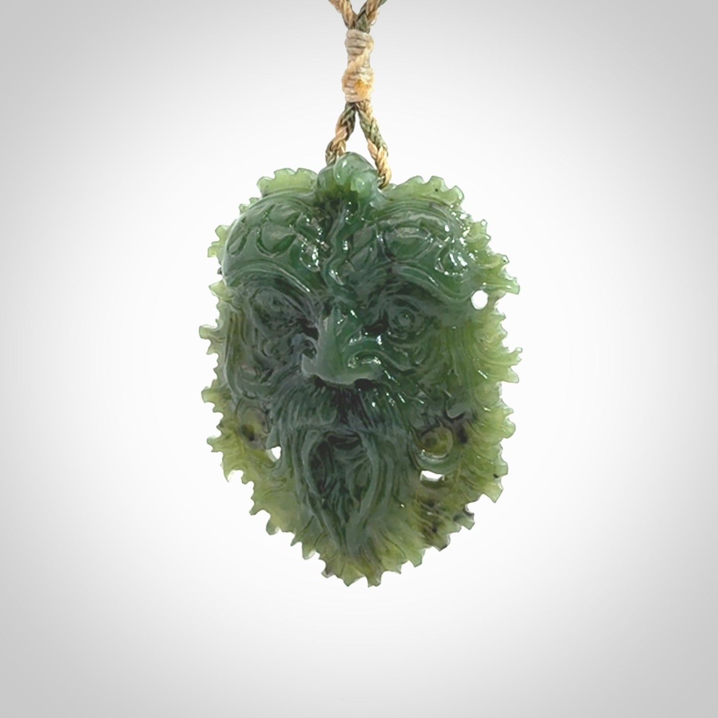 This picture shows a large hand carved forest man face pendant. The cord is hand plaited and adjustable.