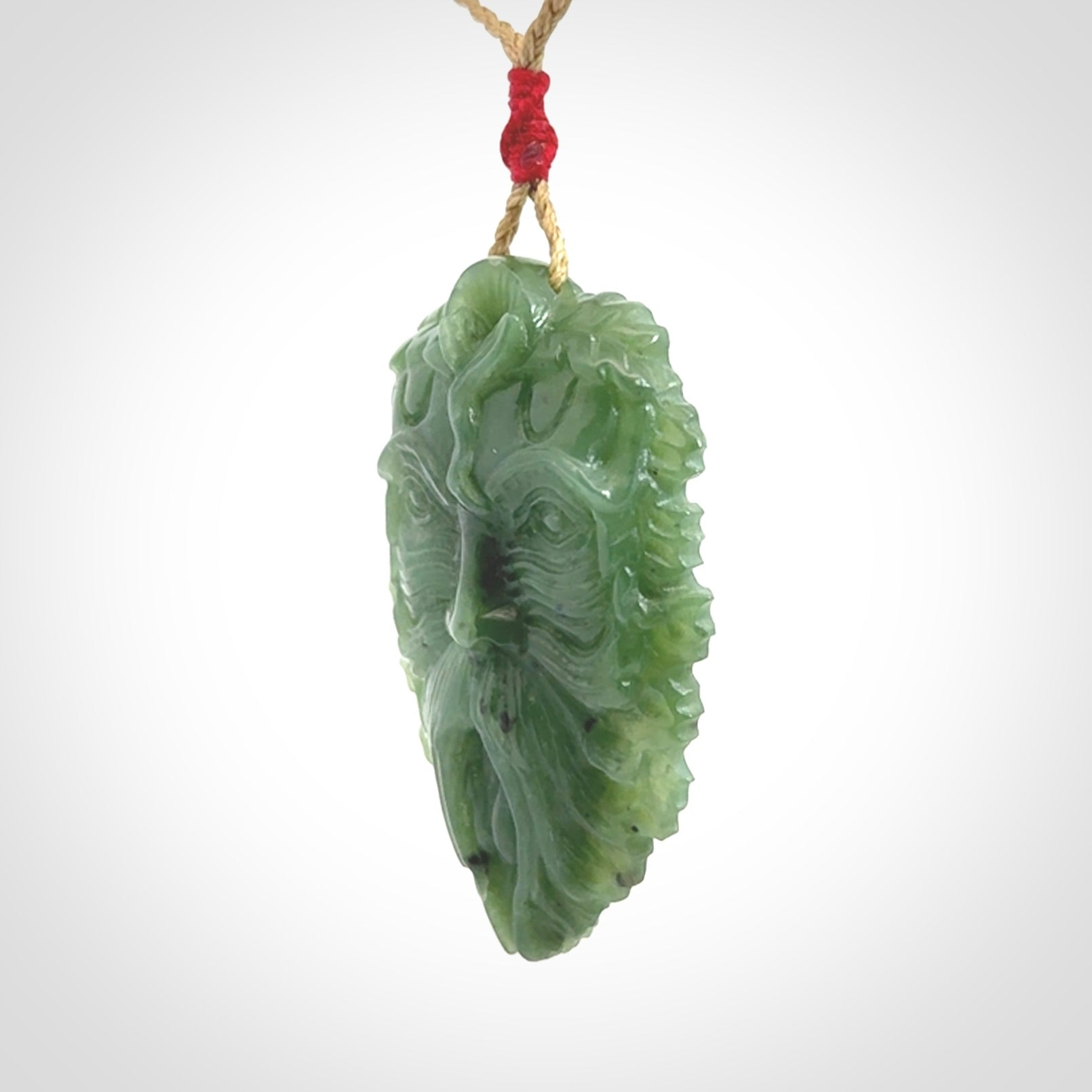 This picture shows a large hand carved forest man face pendant. The cord is hand plaited and adjustable.