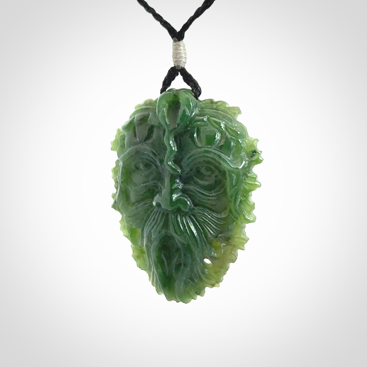 This picture shows a large hand carved forest man face pendant. The cord is hand plaited and adjustable.