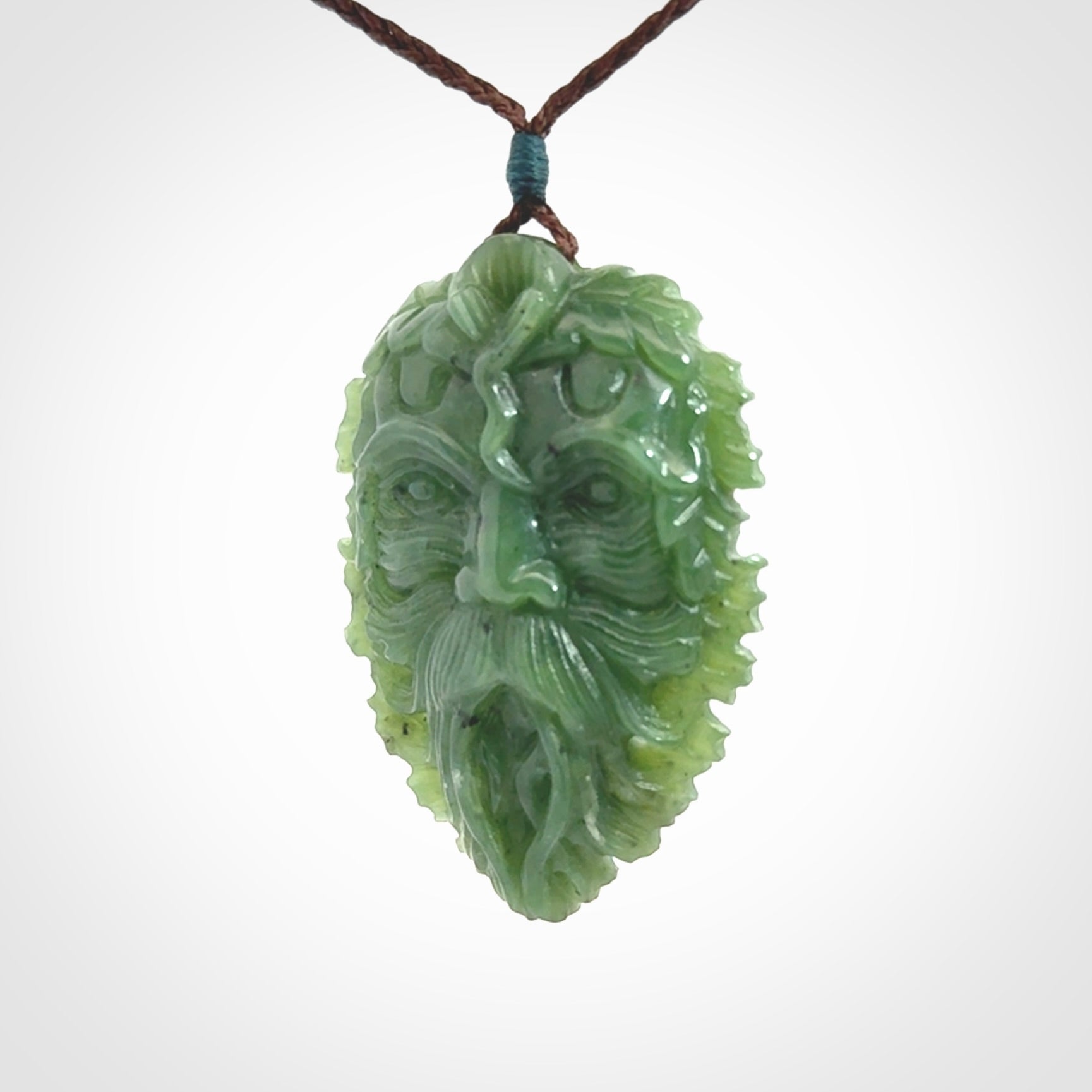 This picture shows a large hand carved forest man face pendant. The cord is hand plaited and adjustable.