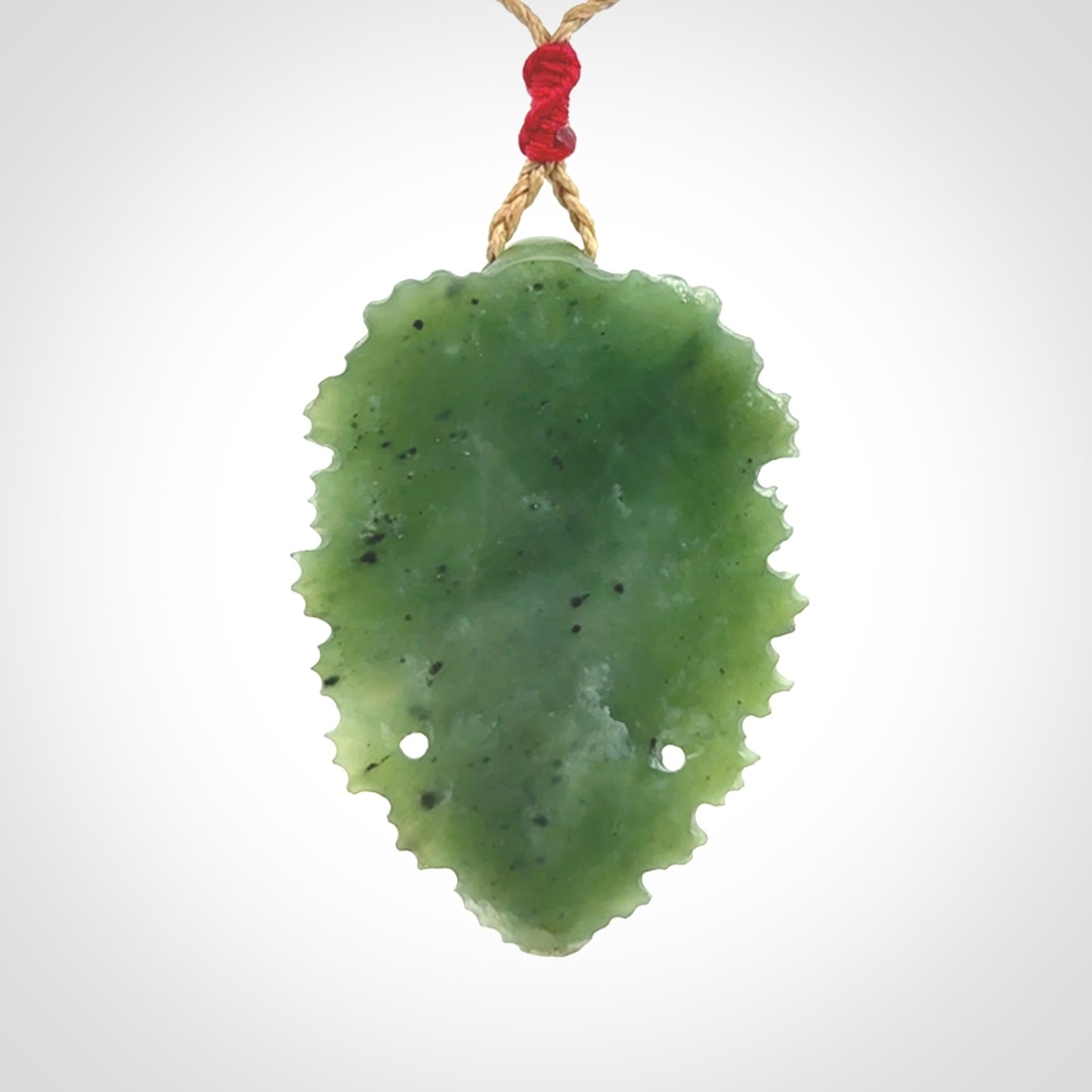This picture shows a large hand carved forest man face pendant. The cord is hand plaited and adjustable.