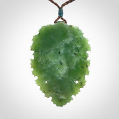This picture shows a large hand carved forest man face pendant. The cord is hand plaited and adjustable.