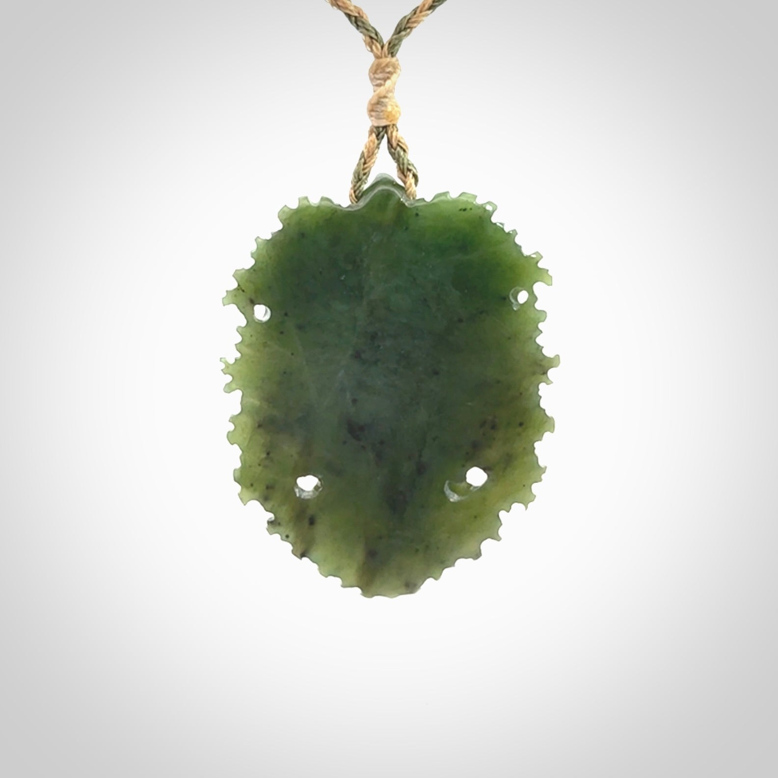 This picture shows a large hand carved forest man face pendant. The cord is hand plaited and adjustable.