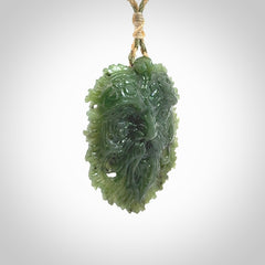 This picture shows a large hand carved forest man face pendant. The cord is hand plaited and adjustable.