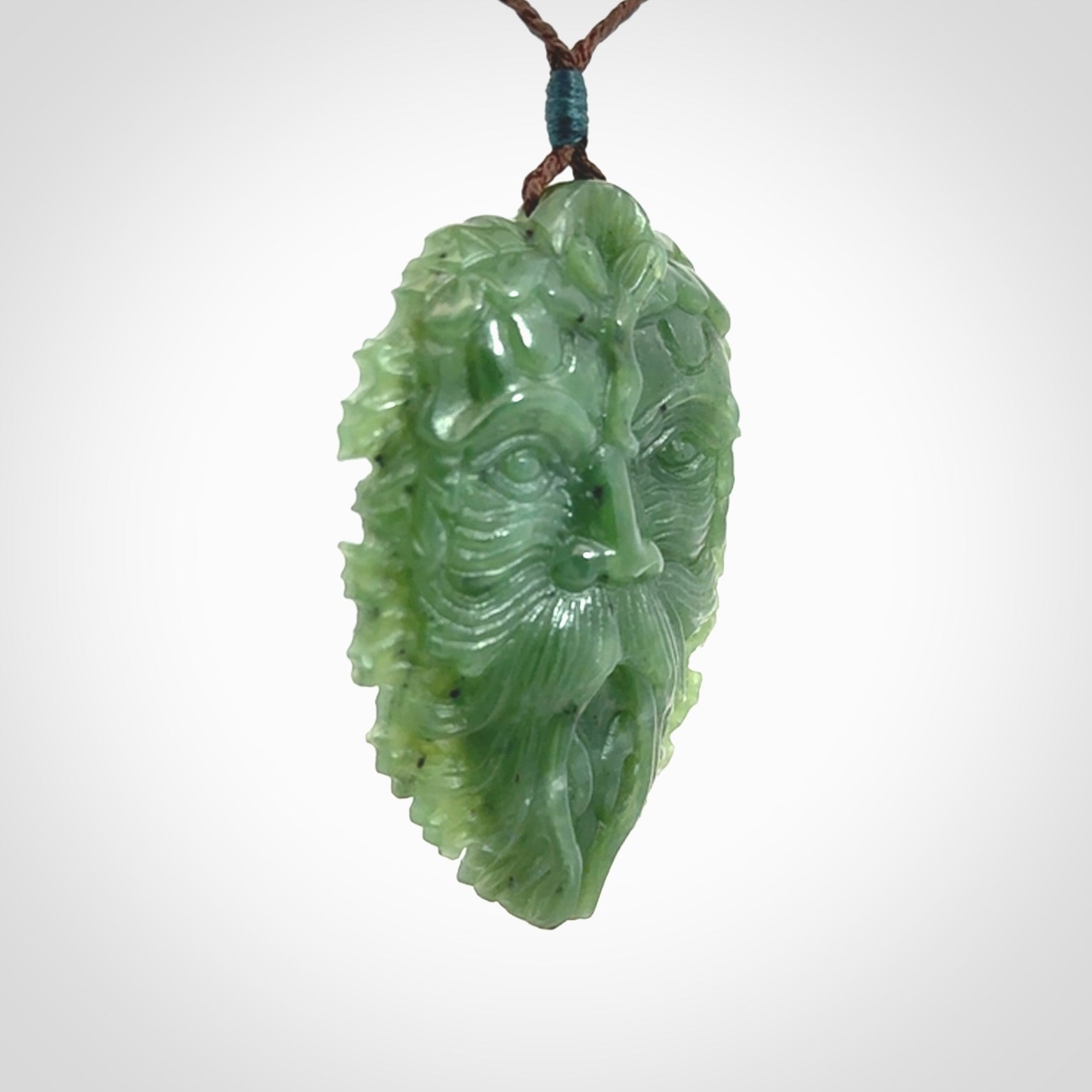 This picture shows a large hand carved forest man face pendant. The cord is hand plaited and adjustable.