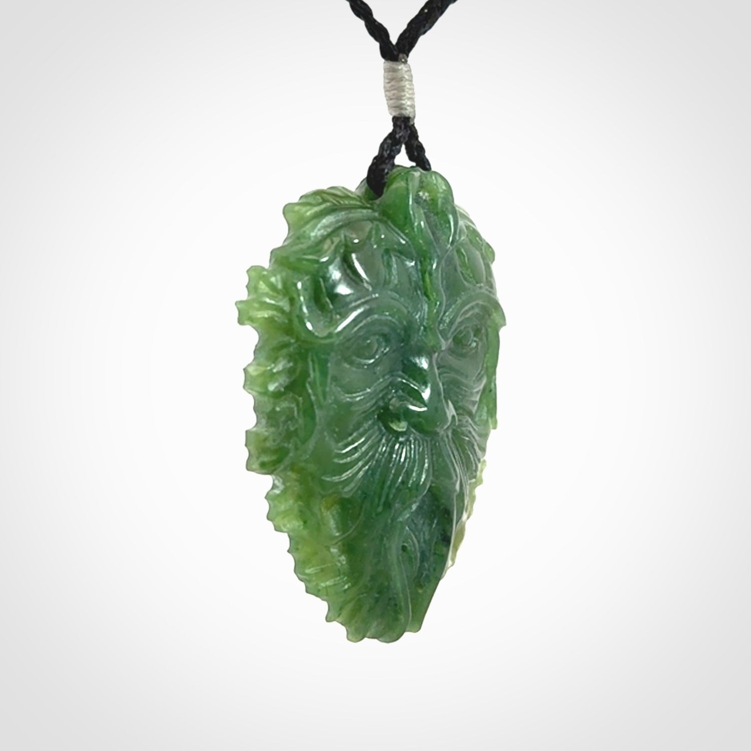This picture shows a large hand carved forest man face pendant. The cord is hand plaited and adjustable.