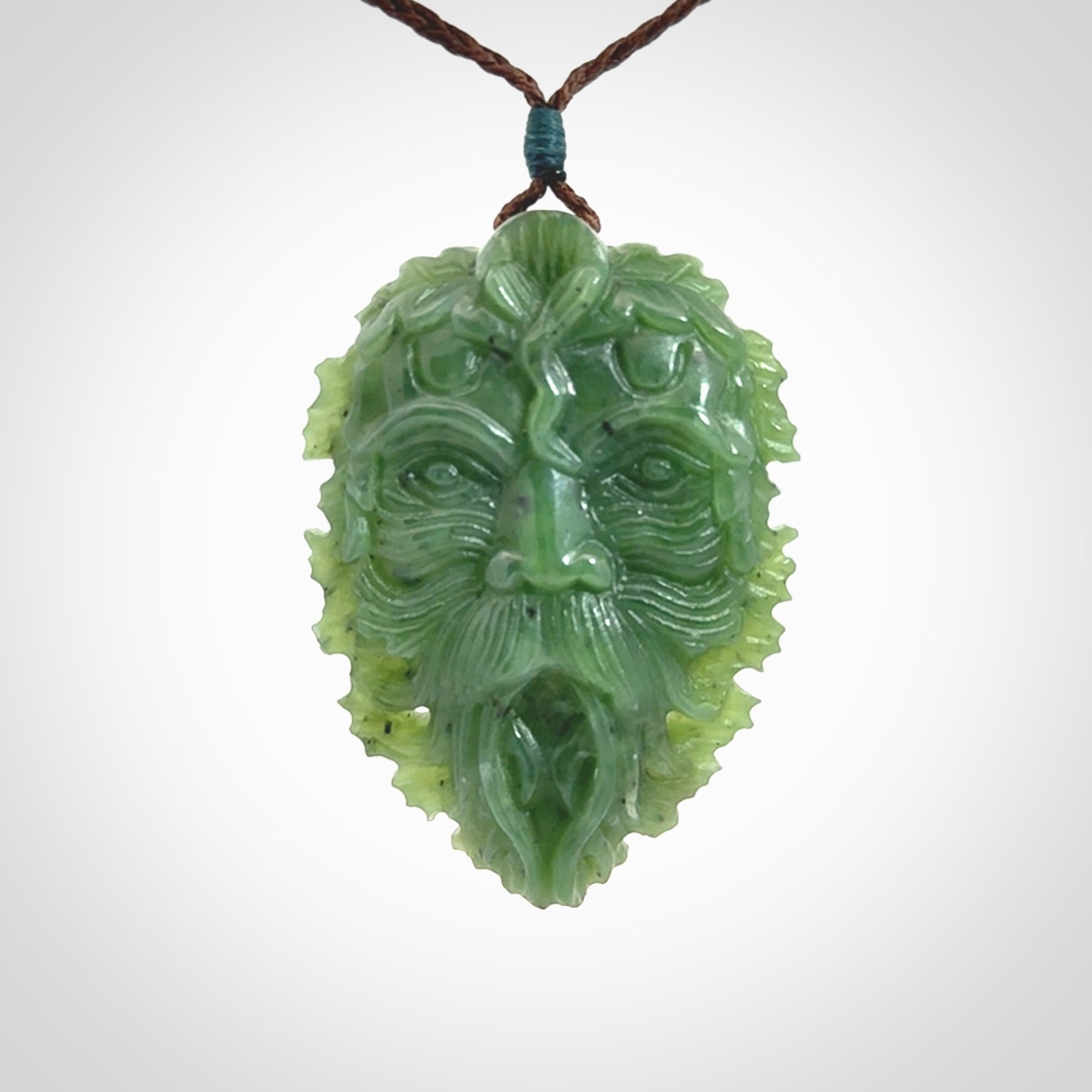 This picture shows a large hand carved forest man face pendant. The cord is hand plaited and adjustable.